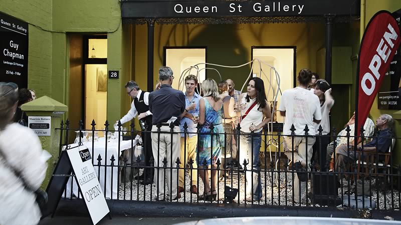 crowd outside art exhibition opening